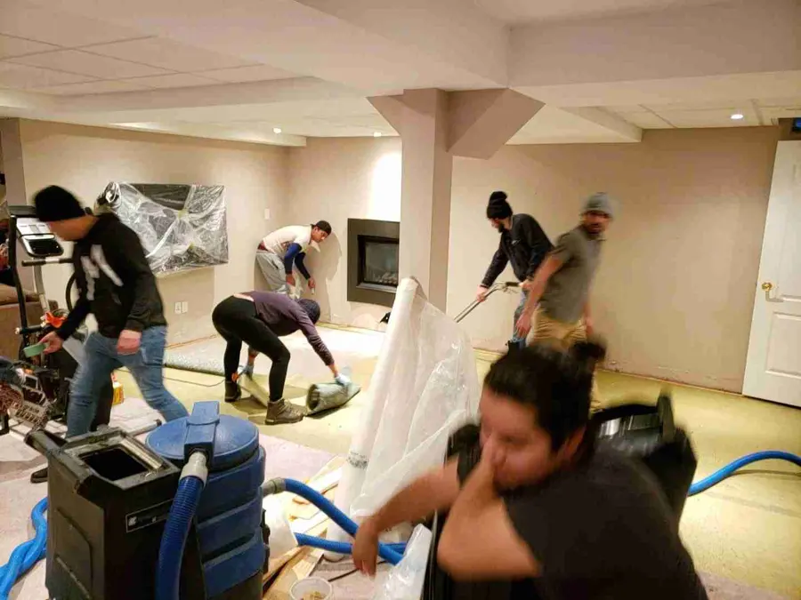 Crew drying a water-damaged interior in Riverton, NJ